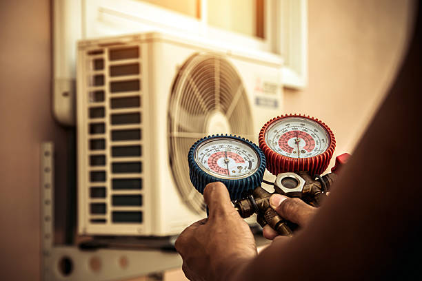 Professional Hvac technician working in Grain Valley, MO